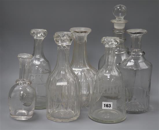 Seven various 19th century glass decanters, four etched with titles